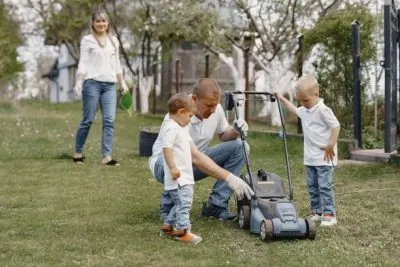 lawn_mower_man_working_backyard_with_sons-1-Copy-400x267